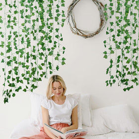 Freyalife artificial ivy scrolls on trellis elevate garden scenery.