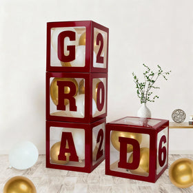 Frigg 2026 maroon graduation balloon boxes create a striking photo backdrop