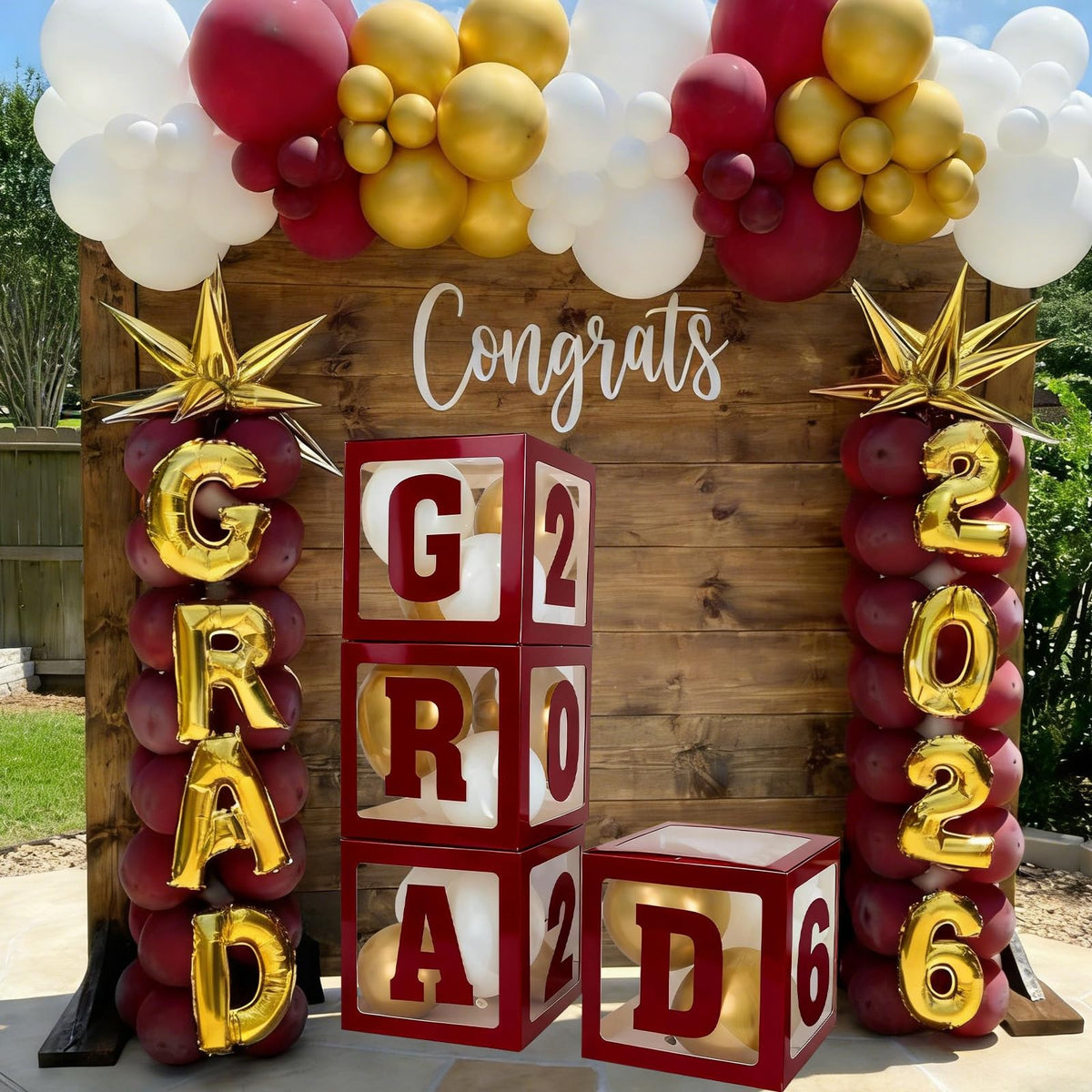 Frigg maroon transparent grad boxes offer a chic backdrop