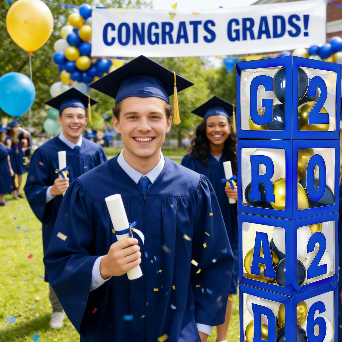 Frigg graduation photo backdrop idea with blue balloon boxes and letters.