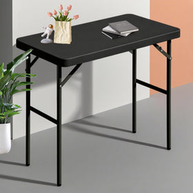 FROASISPRO folding table folded for compact storage and easy transport.