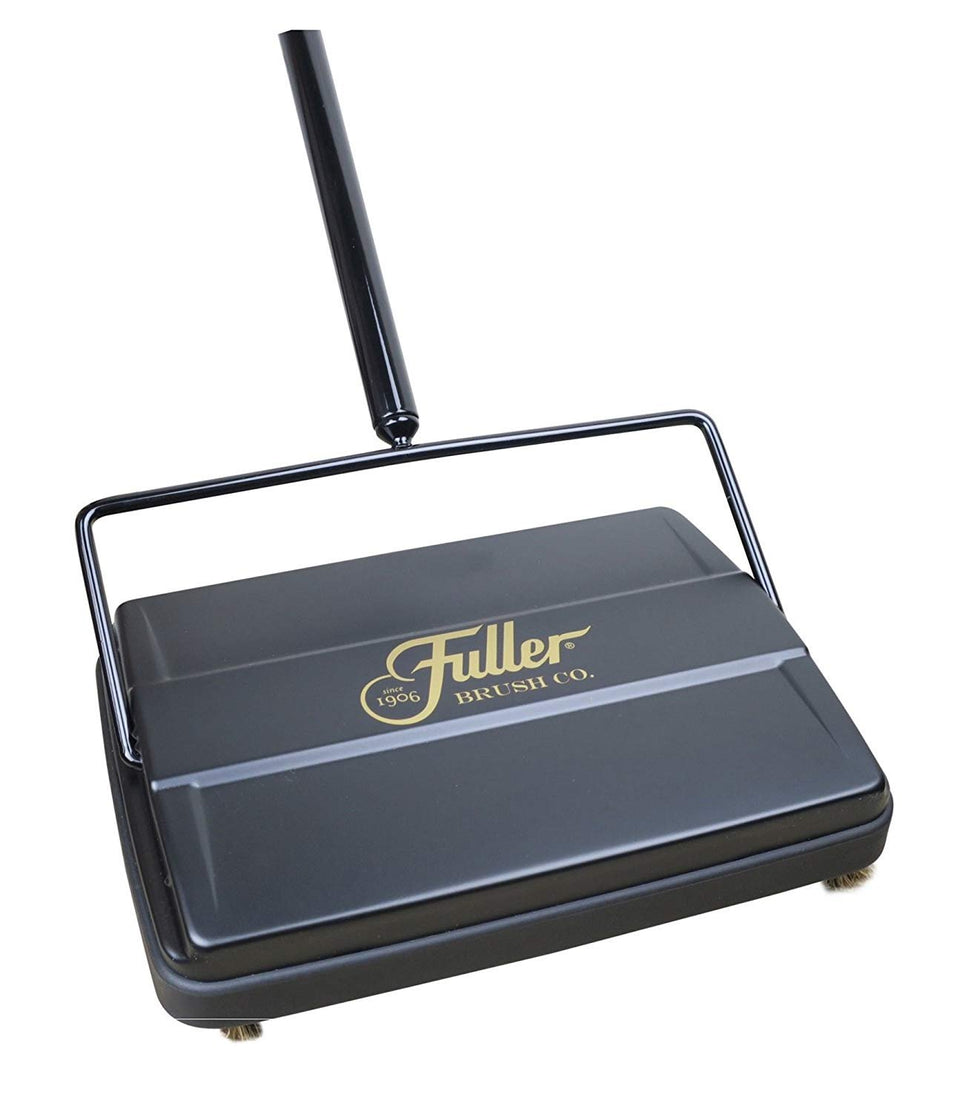 Fuller Brush 17027 sweeper on floor for quick mess cleanup.
