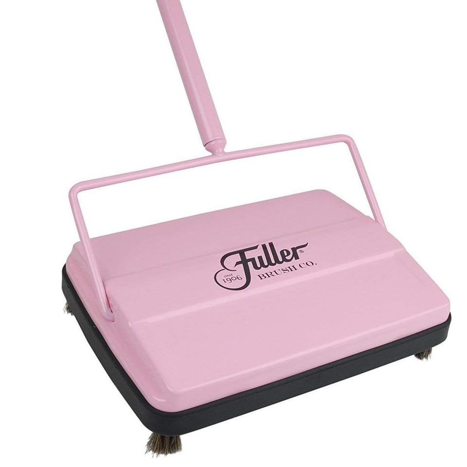 Fuller Brush 17072 electrostatic sweeper on floor attracting crumbs and dust.