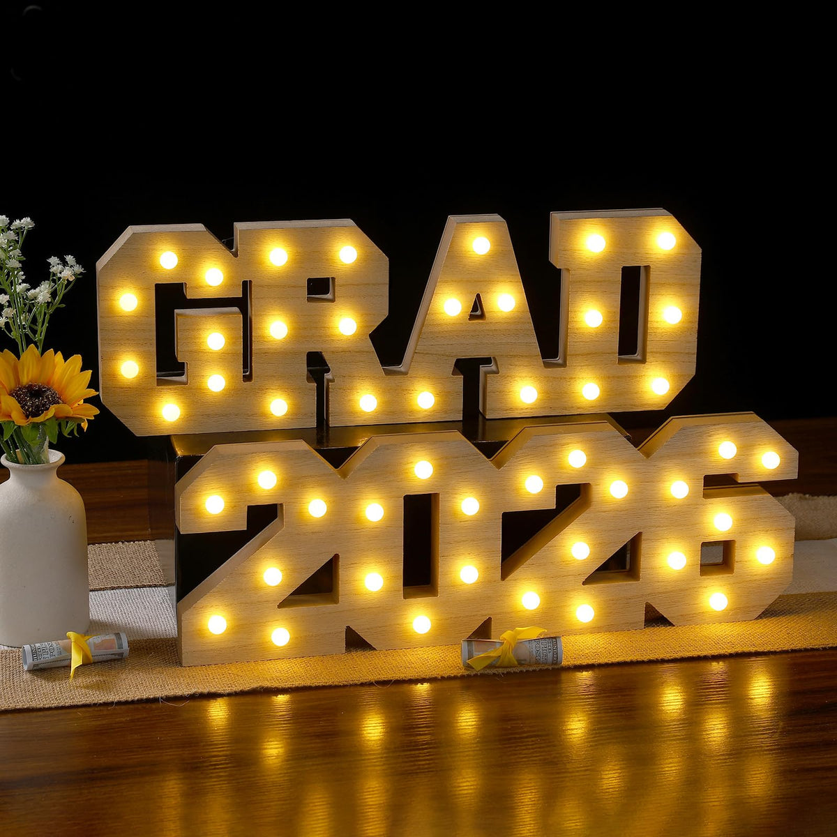 FunouHome Grad 2026 light-up letters illuminate the table as a warm centerpiece.