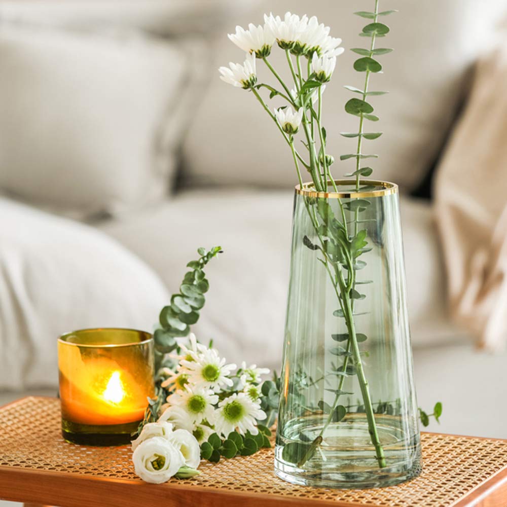 Funsoba vase styled as a centerpiece on a table with flowers.
