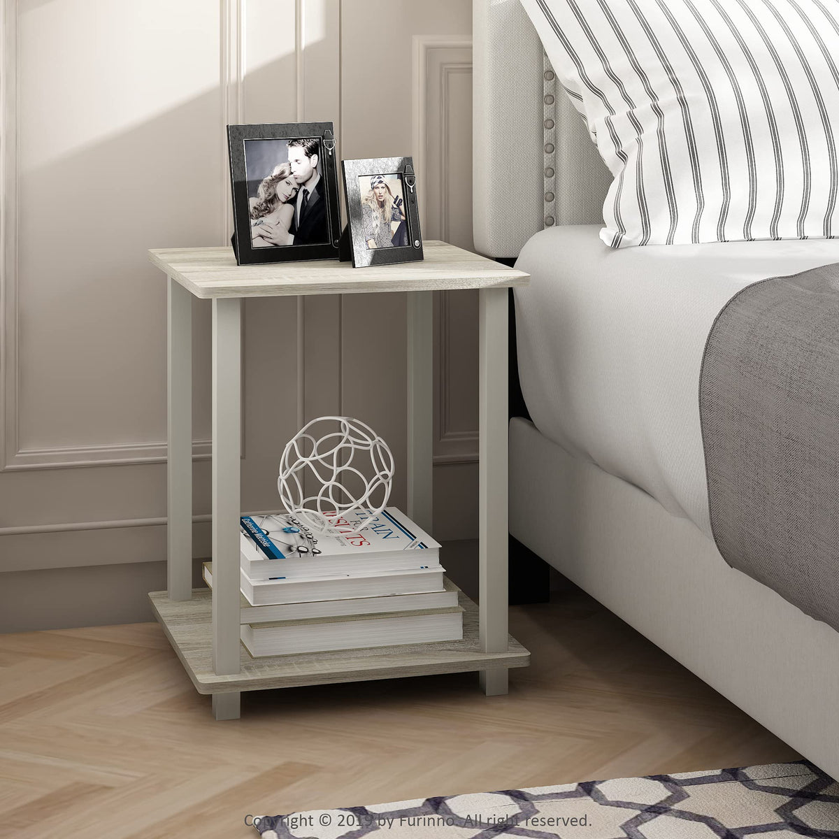 Furinno Simplistic compact living room table beside sofa setup.