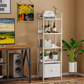 Furologee living room setup shows decorative books and plants