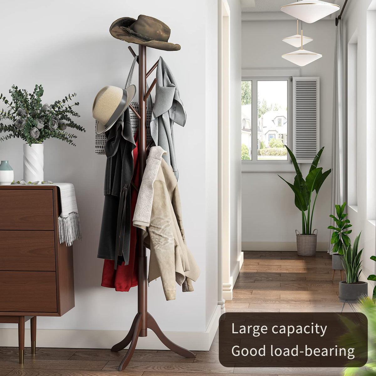 Furshus freestanding coat rack with brown finish in a doorway.