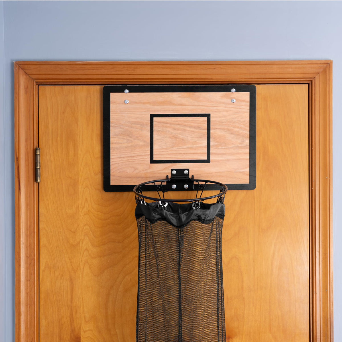 Close-up view of the natural wood backboard on the Fury Strike hamper.