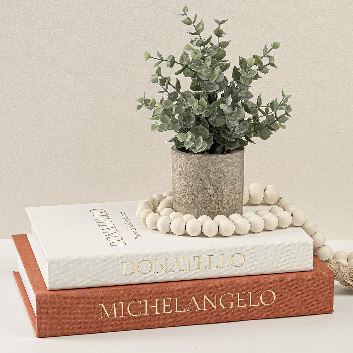 Fveuc beige terracotta faux books on a coffee table add refined storage and style