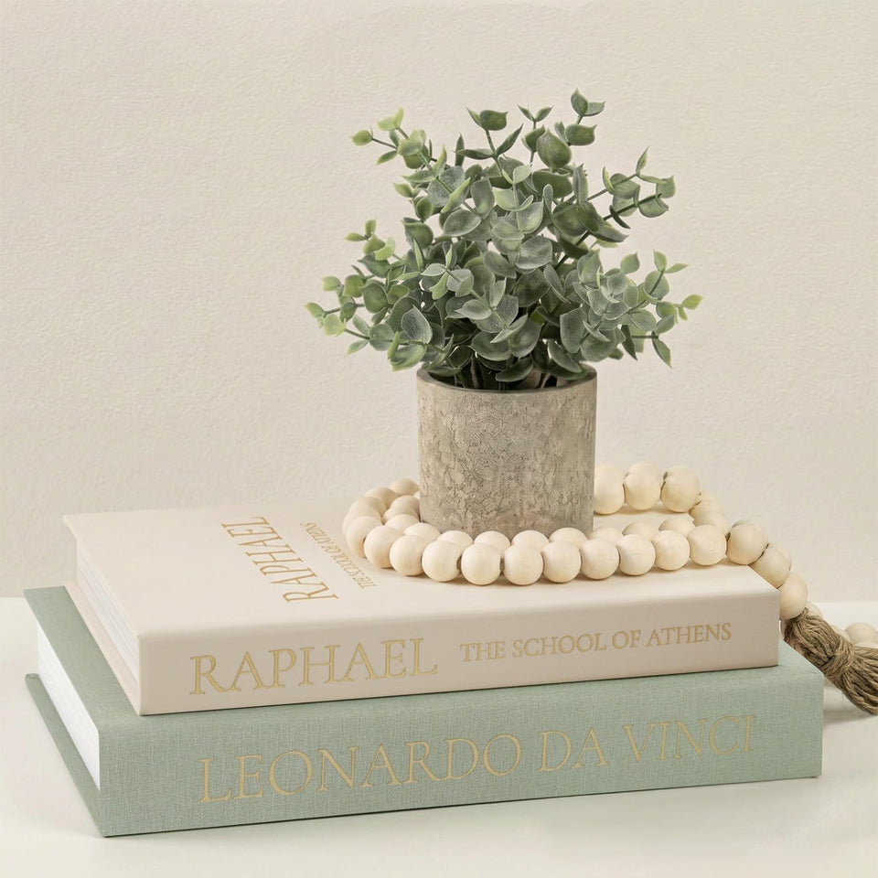 Fveuc decorative linen faux books on a coffee table add stylish, low-profile storage.