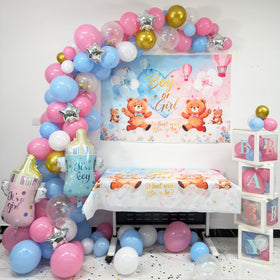 GAILROSO pink and blue balloon arch creates a lush, festive centerpiece.