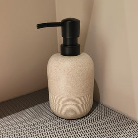 GalDal beige dispenser with embossed bottom-half detail, adds texture to decor.