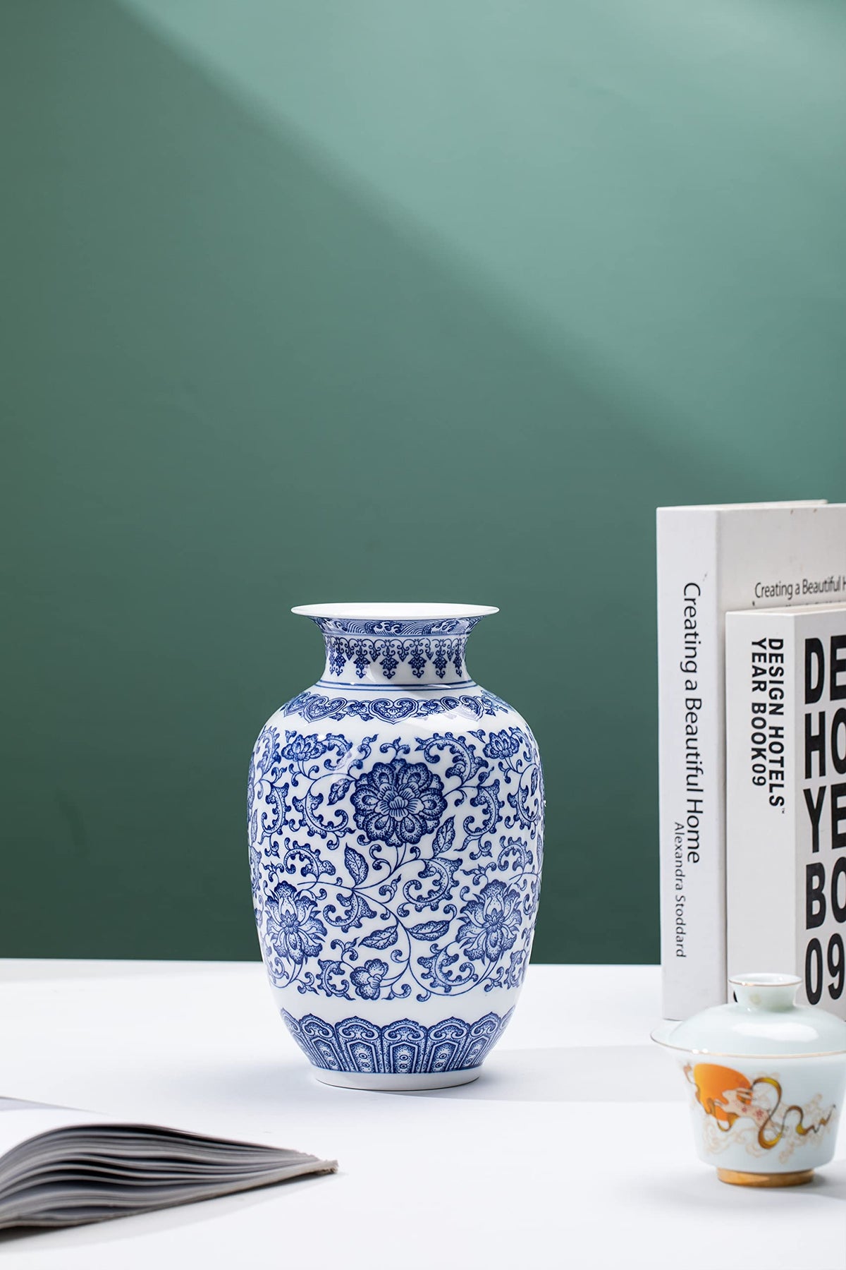 GaLouRo blue vase on the desk enhances workspace ambiance.