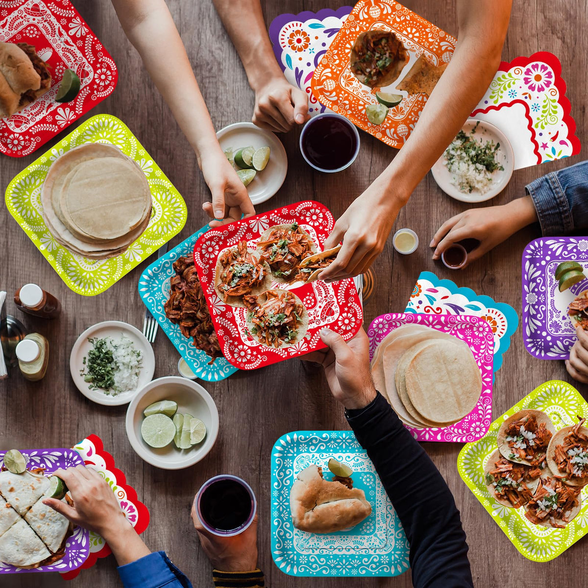 Gatherfun Fiesta Kit papel picado dinner plates bring festive flair to the table.