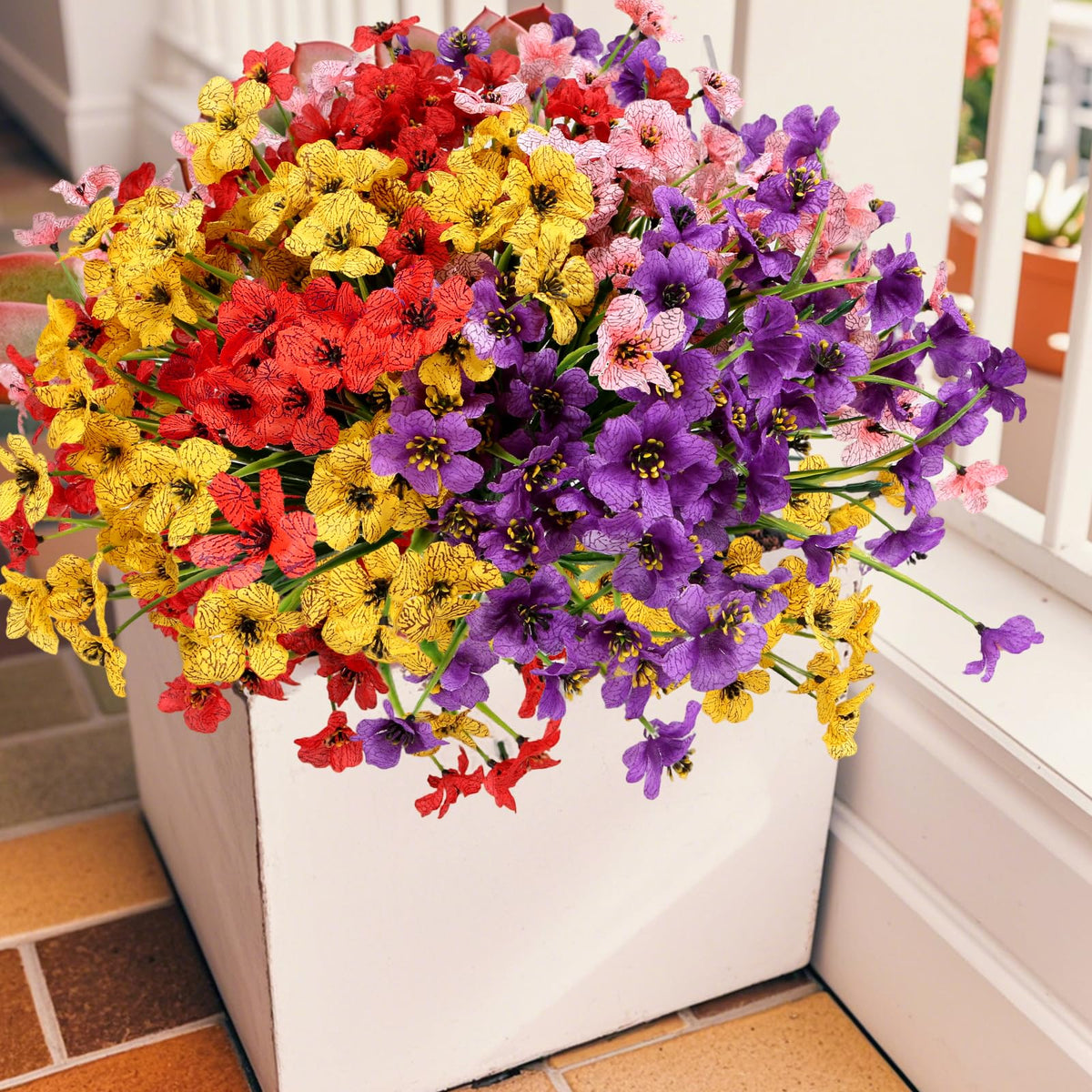 Geegoods plastic flowers provide low-maintenance greenery for patios and walkways.