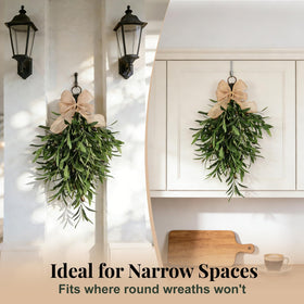 Olive teardrop swag on kitchen cabinet display adds timeless warmth