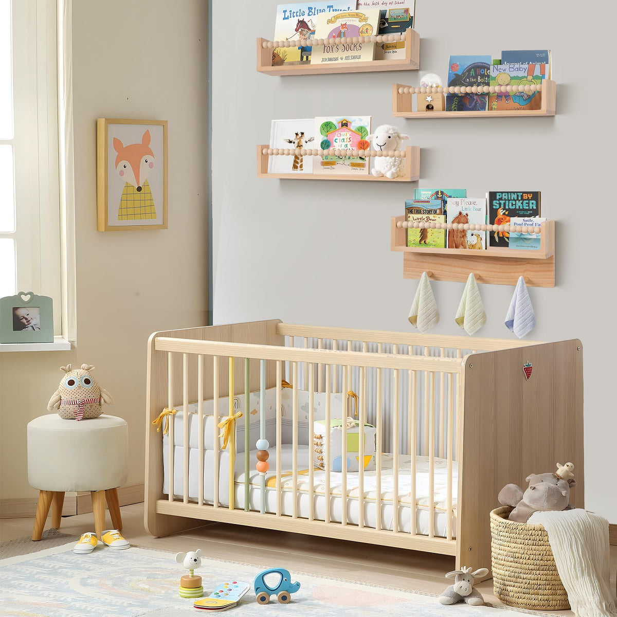 Generic BOMID nursery shelves mounted above a crib for accessible storage.