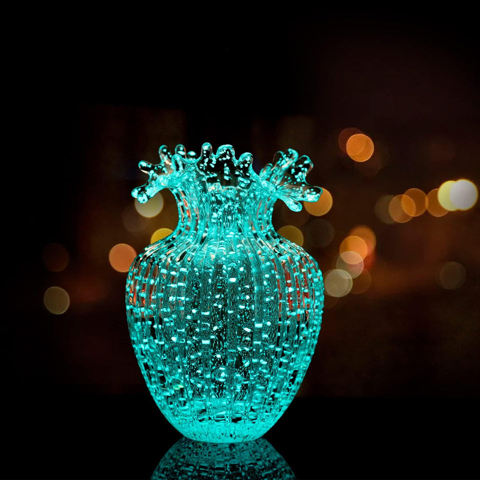 Generic Handmade Glass Flower Vase with luminous waves glows subtly, enhancing living room ambiance at night.