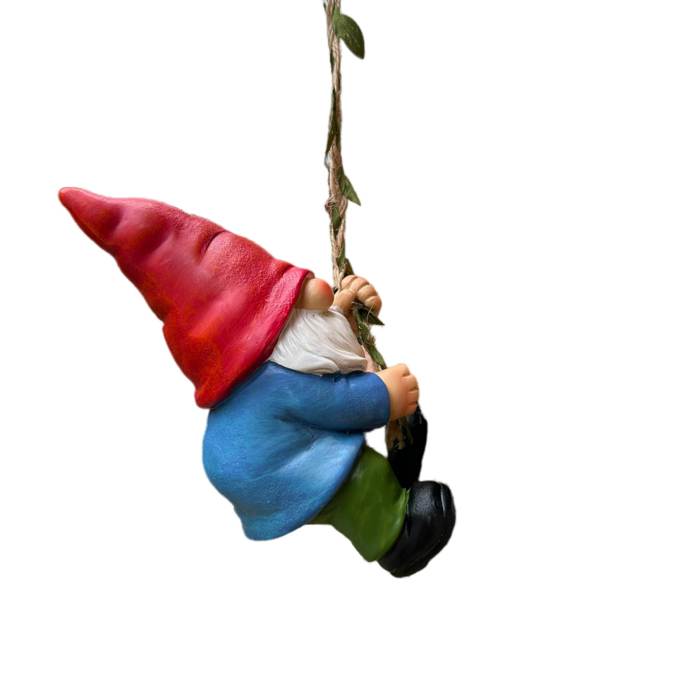 Generic Hanging Gnome garden statue displayed on a branch for outdoor charm.