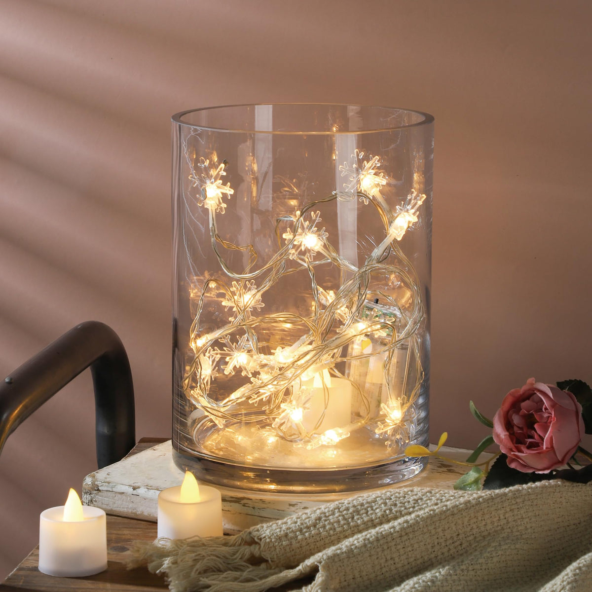 Generic hurricane candle holder glass for ambient lighting with florals.