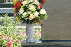 Generic petal-mouth grave vase for memorials and outdoor events.