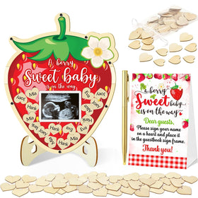 Generic strawberry guest book with wooden frame showcases warm messages for lasting baby shower memories