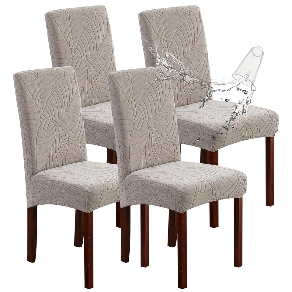 Genina waterproof chair covers on dining four-pack protect surfaces from spills and stains.