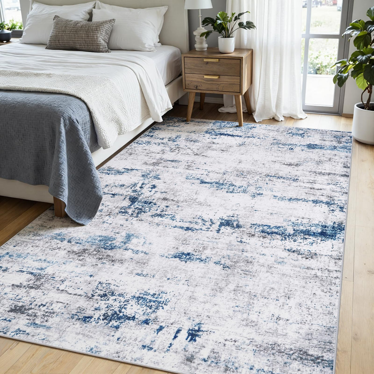 Gent drizz 5x7 area rug shown in white gray blue palette for versatile decor.