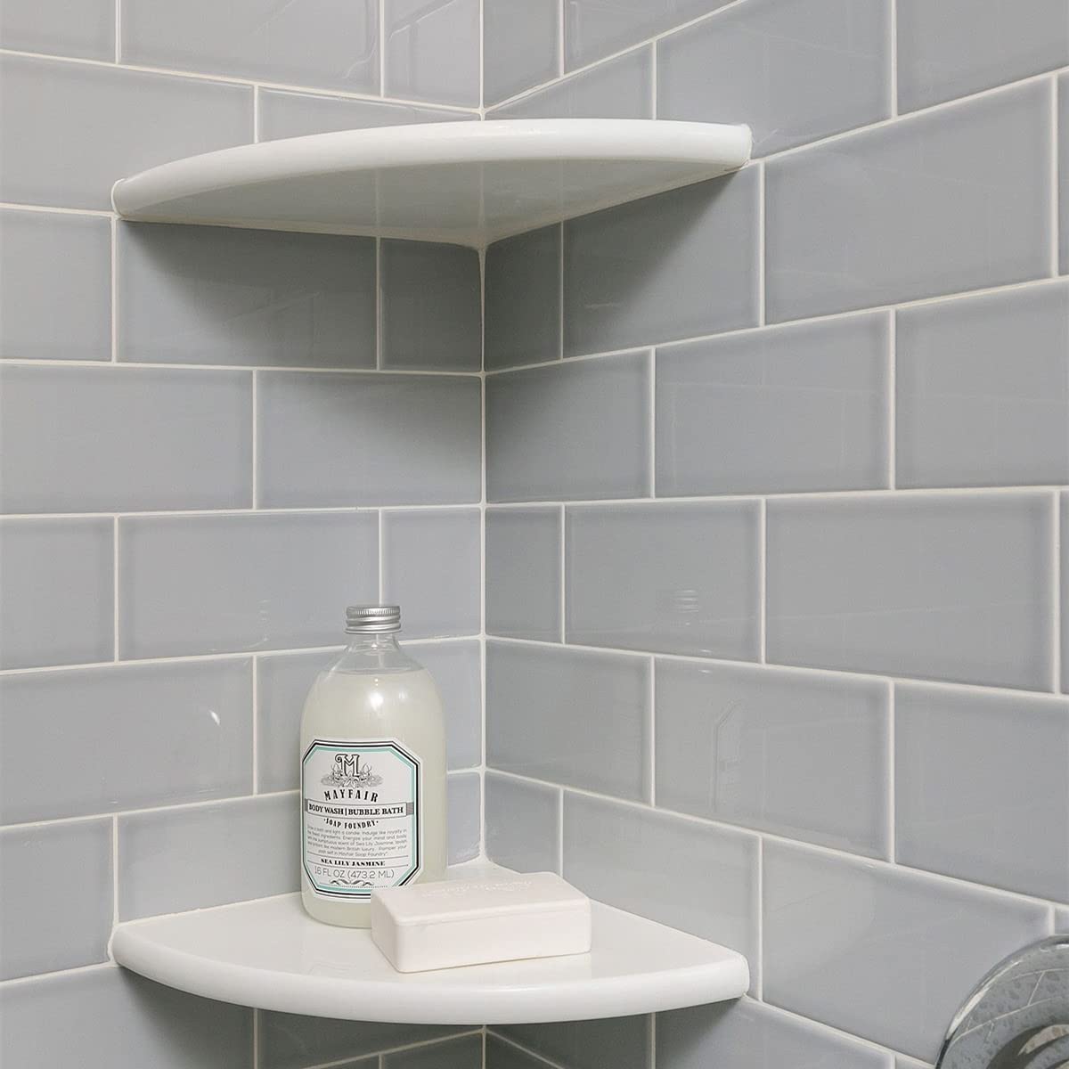 Geoona white marble corner shelf installed in a bathroom corner for towels