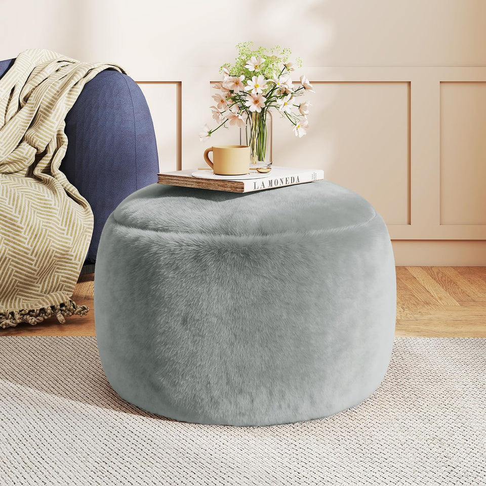 Gericco round stuffed pouf ottoman beside sofa for feet up relaxation