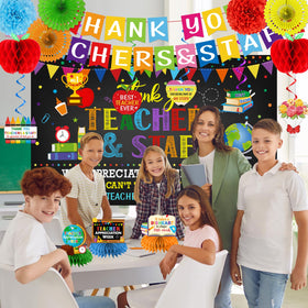 Ghokawu apple tissue pom poms provide school-themed decor touches.