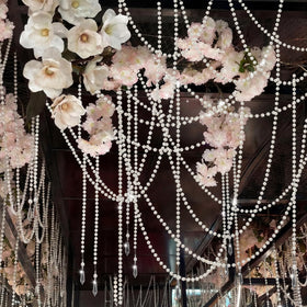 Giegxin faux pearl strands drape gracefully for festive bridal decor.