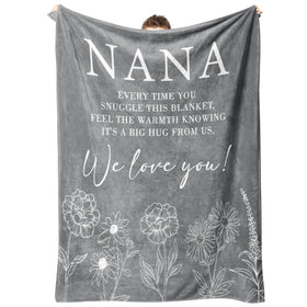 GiltGlimmer Nana gifts soft throw blanket on a cozy couch