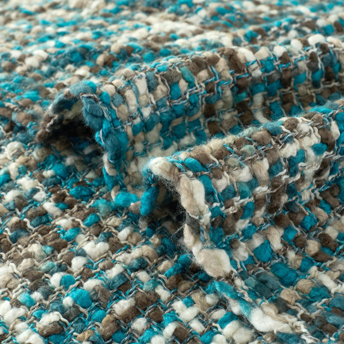 GINAMUSE boho-style throw with decorative tassels on display