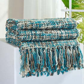 GINAMUSE multi-color teal throw on sofa showing cozy texture and warmth