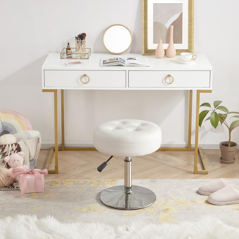 Gitrah round PU leather ottoman adds a luxe look.