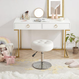 Gitrah round PU leather ottoman adds a luxe look.