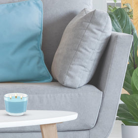 Glade Cool Coconut 3-Wick Candle on heat-resistant surface for safe, steady burn.