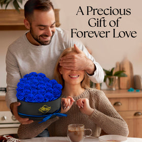 GLAMOUR BOUTIQUE blue 27-rose bouquet in heart box.