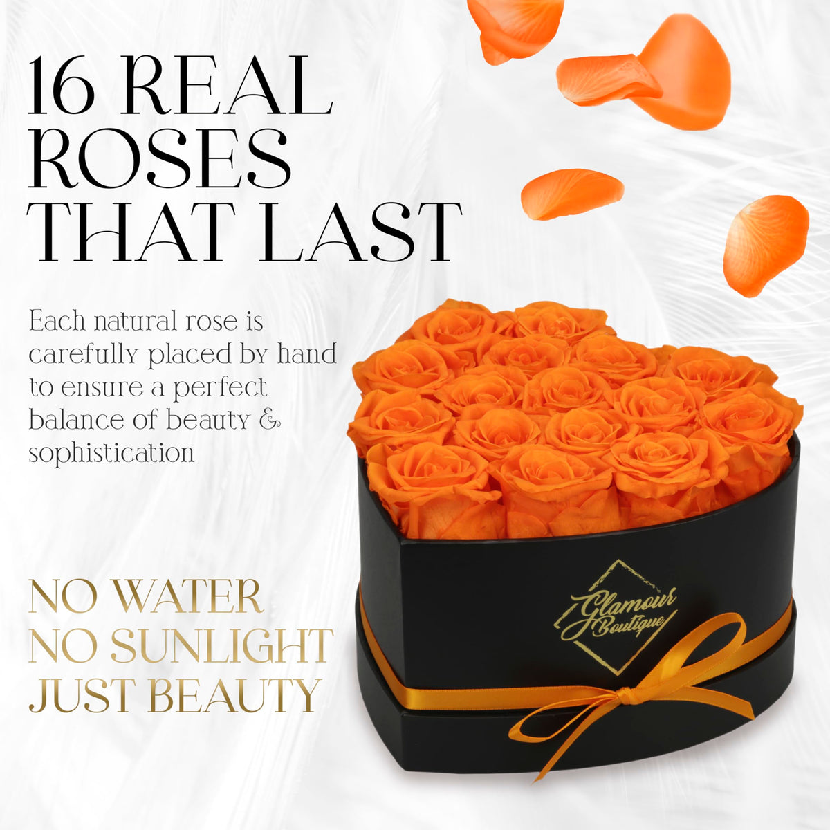GLAMOUR BOUTIQUE heart box front view orange roses highlight timeless gift idea.