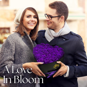 GLAMOUR BOUTIQUE heart box open interior reveals lush rose arrangement.