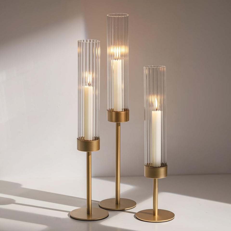 Glasseam gold hurricane candle holder with ribbed glass sleeve to elevate dining ambience.