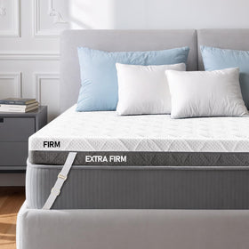 Glendan extra firm queen topper on bed for enhanced support.
