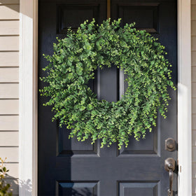 Wreath spans 22-24 inches, ideal for standard doors