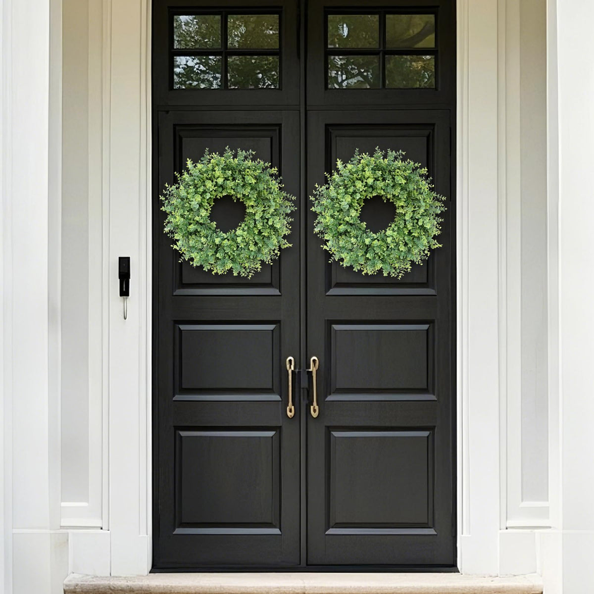 Living room display with GLIDLION eucalyptus wreath adds natural elegance.
