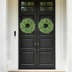 Living room display with GLIDLION eucalyptus wreath adds natural elegance.