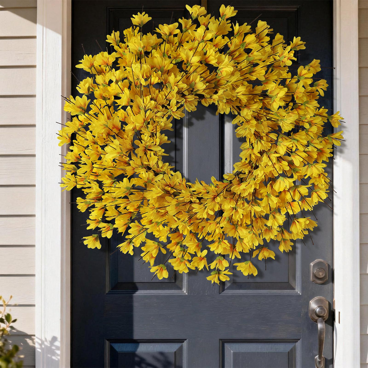GLIDLION forsythia wreath on fireplace mantel adds sunny ambience and focal point.