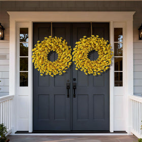 GLIDLION forsythia wreath on porch entrance offers welcoming, bright decor.