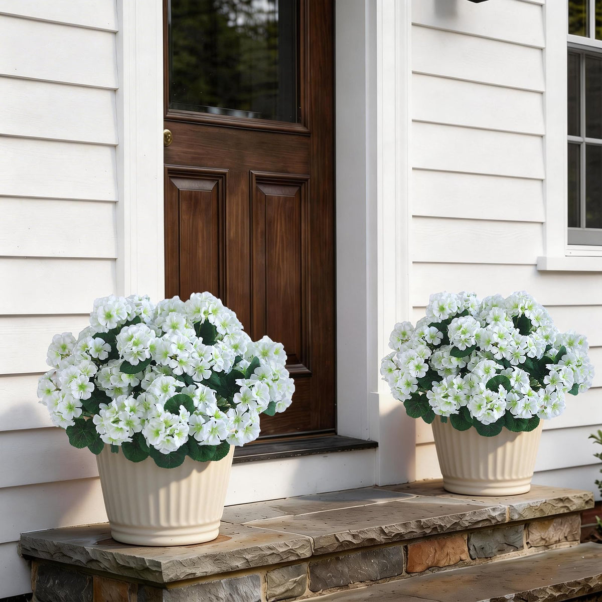 GLIDLION geranium topiary placed in front porch planter for farmhouse curb appeal.
